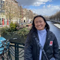 Photo of April Zeng outside on a sunny day